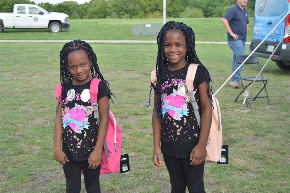 Two Girls Wearing Backpacks
